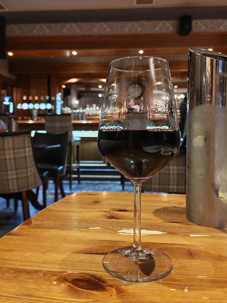 A glass of wine at the bar