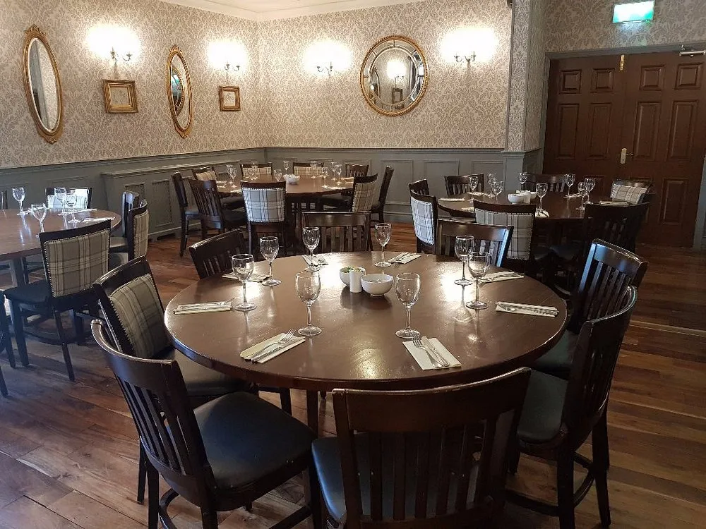 A round table set for a family gathering in the dining room